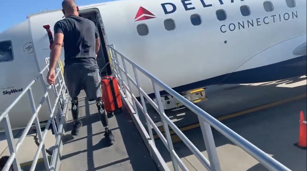 Matthew boarding plane with protheses